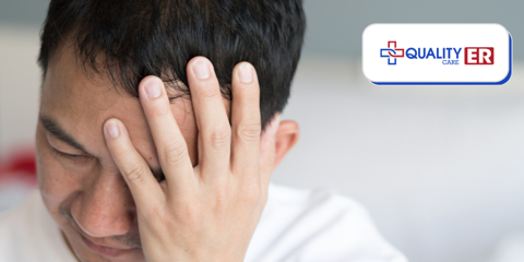 man with a headache concussion holding his head