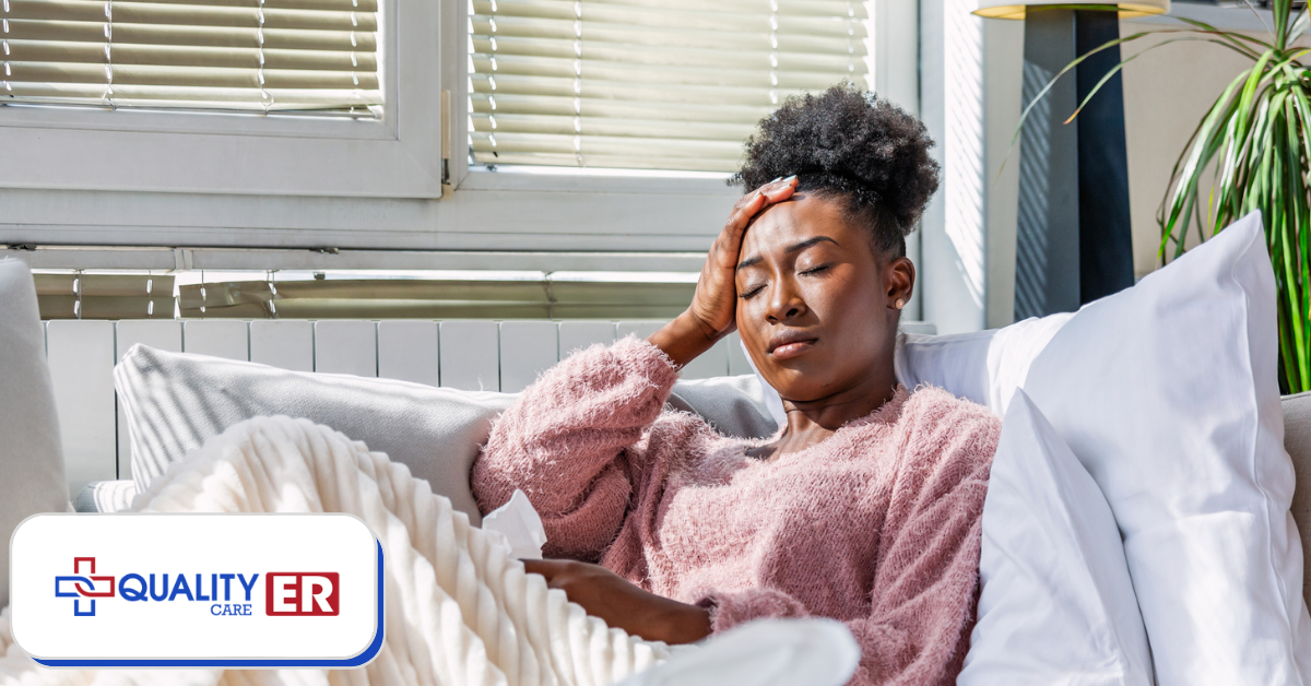 Lady in bed holding her head