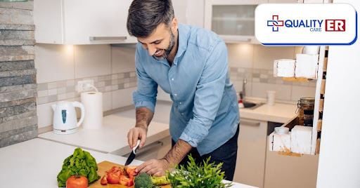 Man cutting up vegetables to make a healthy meal