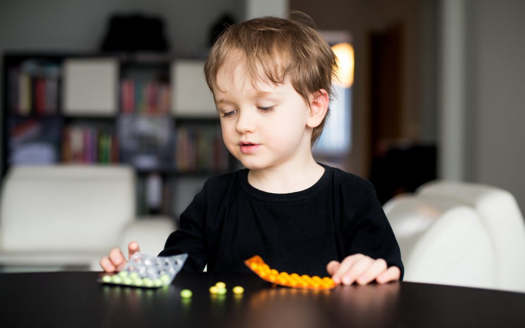 Little boy with pills